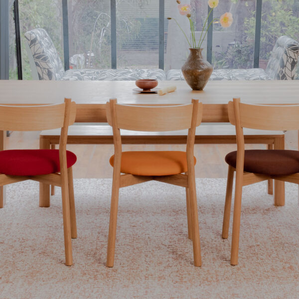 Alor dining set made in American oak with upholstered seat pads in different colors