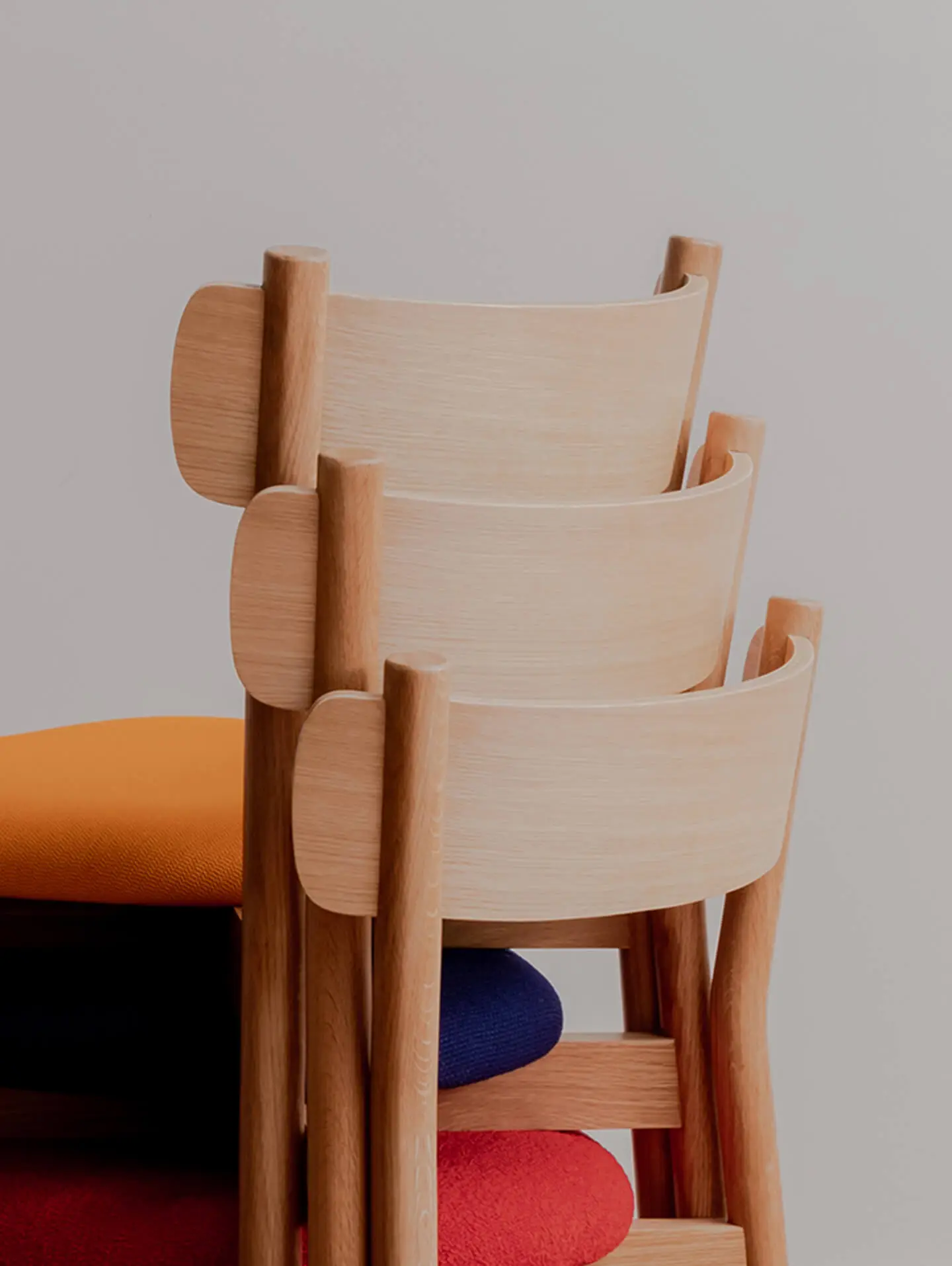 Detail of charlie dining chair back rest stacked three high. Designed in Australia and made from FSC certified timbers