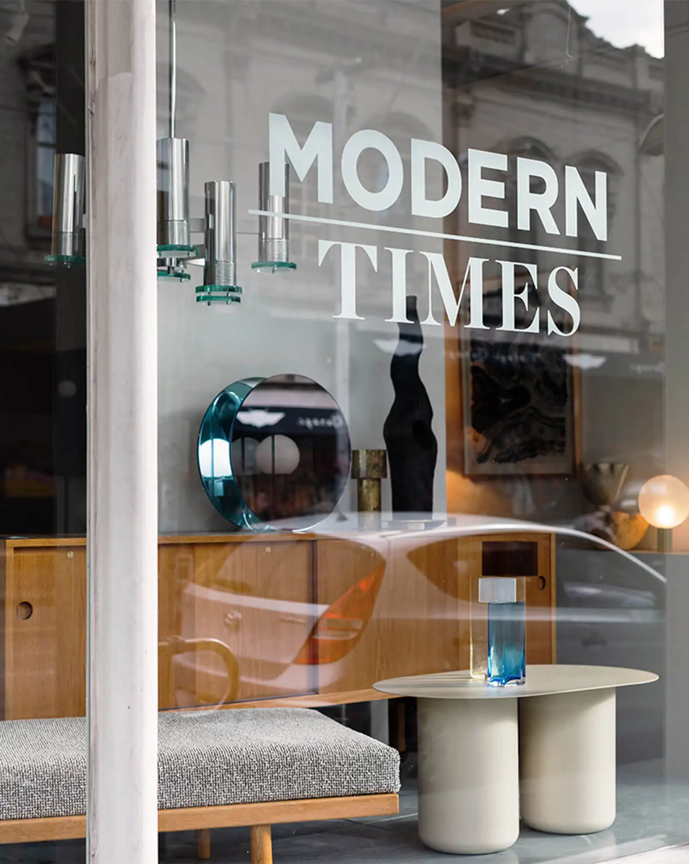 Front window of Modern Times furniture store before closing down.