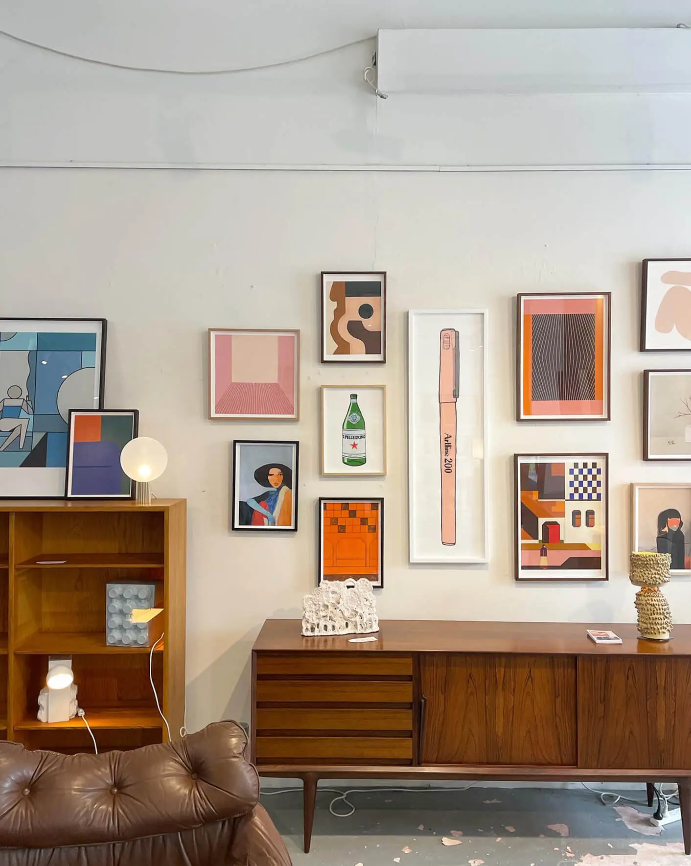 Interior of Modern Times furniture store showing artwork and furniture.